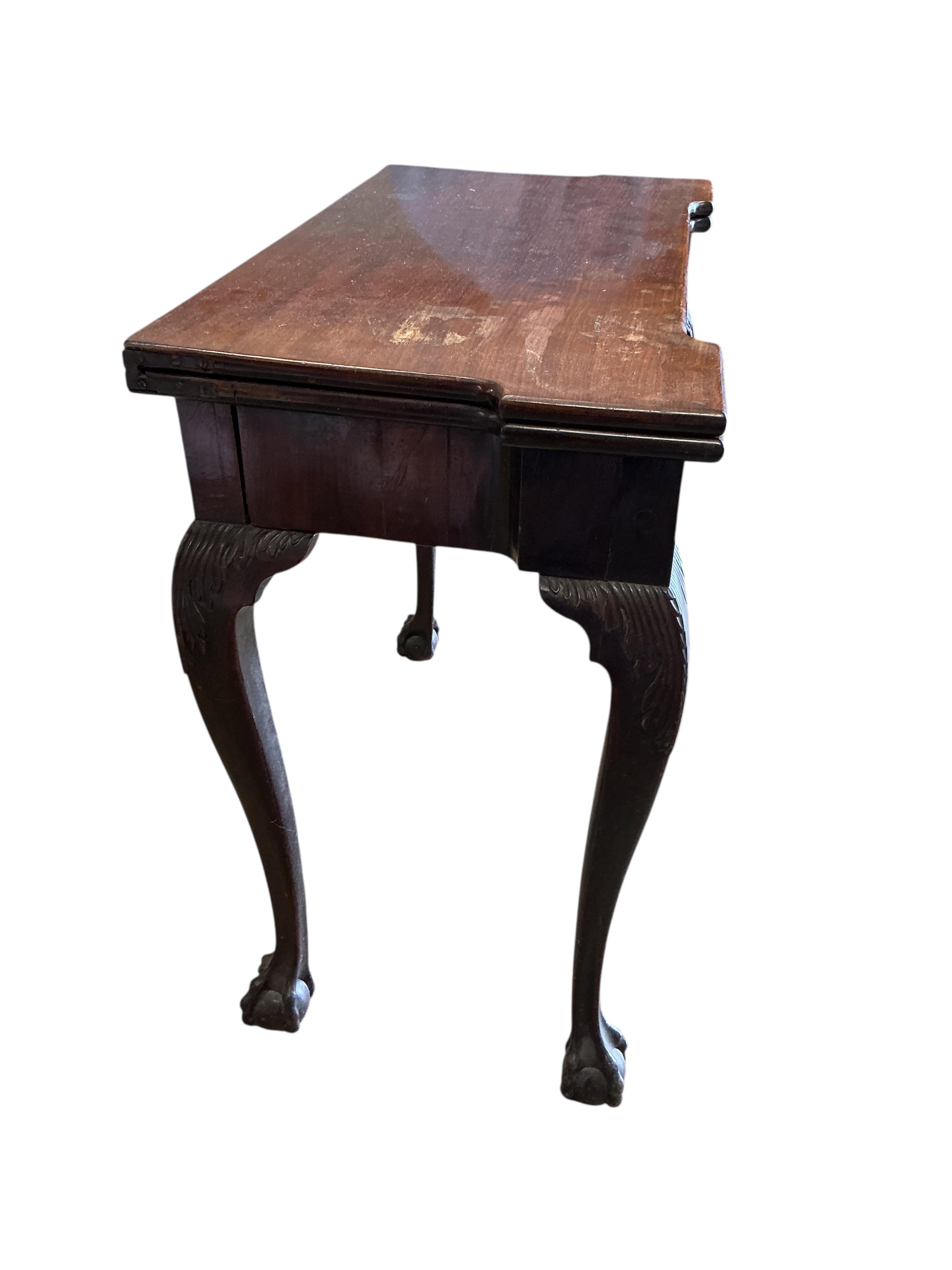 An 18th century rectangular mahogany folding tea table, width 80cm, depth 40cm, height 72cm